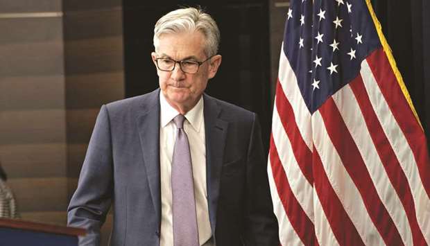 Jerome Powell, chairman of the US Federal Reserve, arrives to speak during a news conference in Washington, DC, yesterday. In a unanimous decision, the Fedu2019s policy-setting committee slashed its key interest rate by a half point to a range of 1.0-1.25 yesterday.