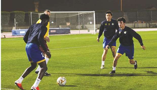 Al Gharafa players train on the eve of their match against Al Wakrah.