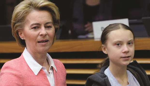 European Commission President Ursula Von der Leyen and Swedish climate activist Greta Thunberg arrive to attend a meeting with European Commissioners in Brussels yesterday.