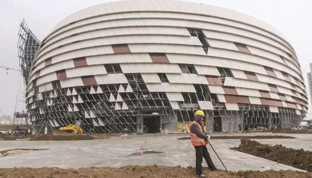 A worker is seen at an opera theatre construction site inside the Dalian Wanda Groupu2019s Oriental Movie Metropolis project site in Qingdao. The Chinese conglomerate that borrowed billions of dollars to fund an acquisition binge, is facing a wall of maturing debt and a deadly virus that has hampered its operations.