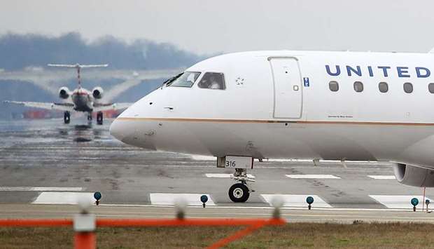 A United Airlines passenger jet prepares to take off from Reagan National Airport yesterday.