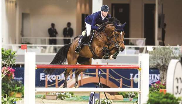 German rider Daniel Deusser gallops to victory with 10-year-old bay mare Kiana van het Herdershof in the CSI5* 1.55m class during the second day of the Global Champions Tour at the Longines Arena at Al Shaqab yesterday. At bottom, Qataru2019s Khalifa Abdulla al-Khaldi who won the Small Tour class in the Hathab series.