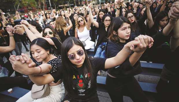 Women protest against gender violence and femicides at Angel de la Independencia monument in Mexico City last month.