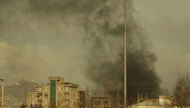 Smoke rises from the site of a gun attack following an attack in Kabul