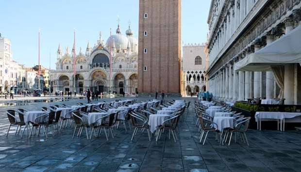 Empty restaurant tables are seen in St. Mark's Square as the Italian government prepares to adopt new measures to contain the spread of coronavirus in Venice, Italy
