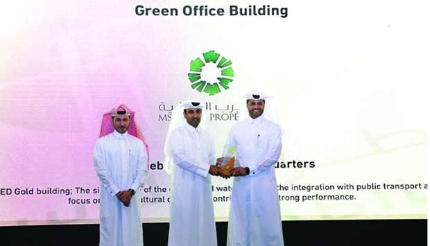 Msheireb Properties officials receiving the u201cGreen Office Building Awardu201d.