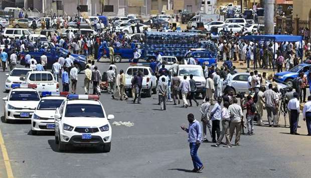 Sudanese rescue teams and security forces gather at the site of an assassination attempt against Sudan's Prime Minister Abdalla Hamdok, who survived the attack with explosives unharmed, in the capital Khartoum