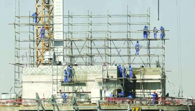 Labourers installing scaffolding at the construction site of a new building in Doha (file). The Planning and Statistics Authority figures suggest that the total number of new building permits issued in February stood at 364, of which 27%, or 177, was in Doha.