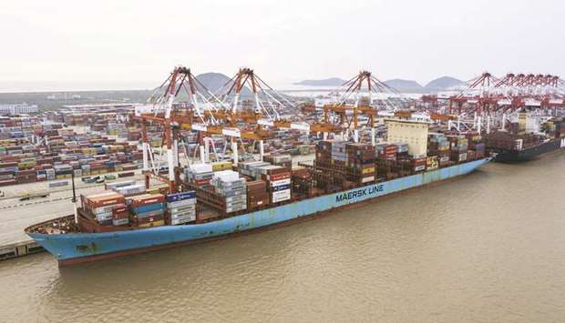 A container ship is docked at the Yangshan Deepwater Port in Shanghai.