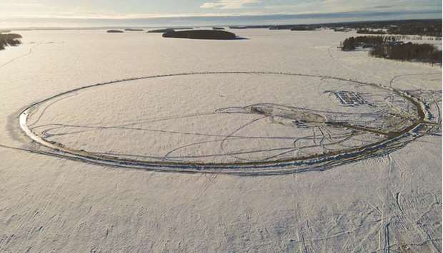 An aerial view shows the perimeter of the ice carousel under construction for a world record attempt on a frozen lake in Lappajarvi, Finland.