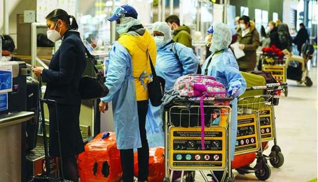 Passengers at a check-in counter in the departures hall at Barajas airport in Madrid, Spain. Future travel trends highlighted in the IATA survey indicate 57% expect to be travelling within two months of the pandemic being contained (improved from 49% in September 2020).