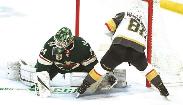 Minnesota Wild goaltender Kaapo Kahkonen (left) makes a save against Vegas Golden Knightsu2019 Jonathan Marchessault in the third period of the NHL game at Xcel Energy Center in Saint Paul, Minnesota, United States, on Wednesday. (USA TODAY Sports)