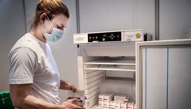 Staff member handles AstraZeneca Covid-19 vaccines in storage at Region Hovedstaden's Vaccine Center, Copenhagen, Denmark February 11, 2021