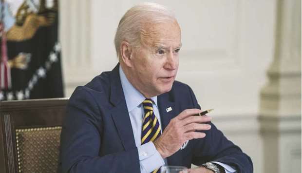 US President Joe Biden speaks during a meeting in the White House in Washington, DC. The package, which Biden signed into law on Thursday, will inject $1.9tn in aid into the pandemic-damaged economy.