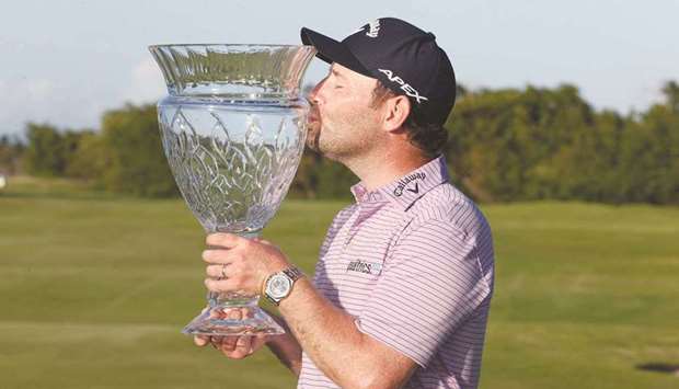 Branden Grace kisses the trophy after winning the Puerto Rico Open in Rio Grande, Puerto Rico. (Getty Images/AFP)
