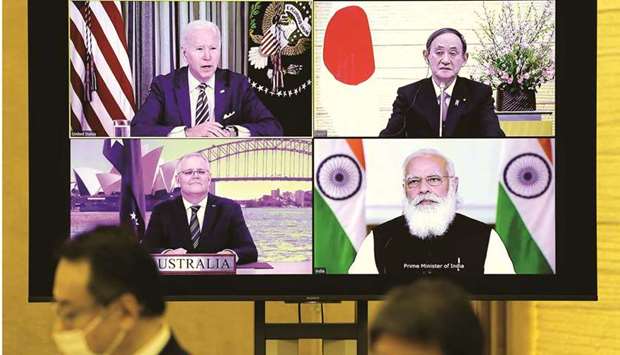 A monitor displaying the virtual meeting of US President Joe Biden (top left), Australiau2019s Prime Minister Scott Morrison (bottom left), Japanu2019s Prime Minister Yoshihide Suga (top right) and Indiau2019s Prime Minister Narendra Modi is seen during the virtual Quadrilateral Security Dialogue (Quad) meeting, at Sugau2019s official residence in Tokyo yesterday.