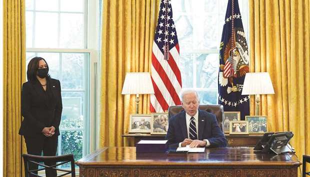 President Biden and Vice-President Harris are seen in the Oval Office during signing of the American Rescue Plan on Thursday.