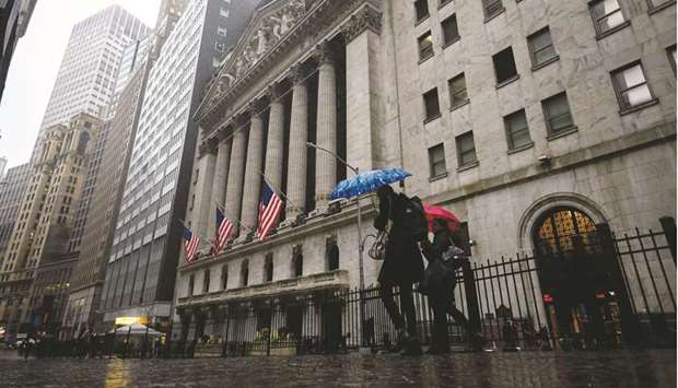 People pass the New York Stock Exchange. Investors betting on US energy shares have enjoyed a blistering rally, as the sector leads a move into value and economically sensitive stocks that has gripped the equity market.