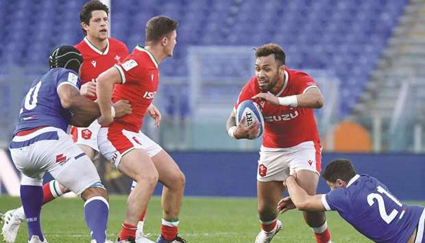 Italyu2019s Marcello Violi (bottom) tackles Walesu2019 Willis Halaholo during the Six Nations rugby union tournament at the Olympic stadium in Rome yesterday. (AFP)