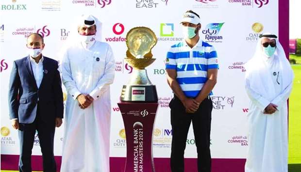 (From left) Commercial Banku2019s GCEO Joseph Abraham, Commercial Banku2019s Board Member Sheikh Faisal bin Fahad bin Jassim al-Thani, Qatar Masters 2021 champion Antoine Rozner and Qatar Golf Association President Hassan al-Naimi during the trophy presentation at Education City Golf Club Sunday PICTURES: Jayan Orma.