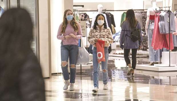 Shoppers carry bags inside the Westfield San Francisco Centre shopping mall in San Francisco. Retail sales in the US dropped by a seasonally adjusted 3.0% last month, the Commerce Department said.