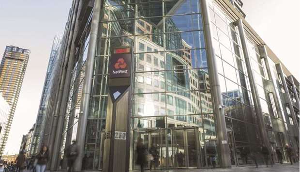 Pedestrians pass a Natwest Group logo at the headquarters of the Royal Bank of Scotland Group in London. The Financial Conduct Authority (FCA) said it was bringing the proceedings after NatWestu2019s systems failed to adequately monitor and scrutinise activity over an account held by a British customer between November 2011 and October 2016.