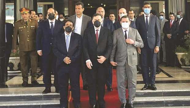 Libyau2019s Prime Minister Abdulhamid Dbeibeh, Libyau2019s internationally recognised former prime minister Fayez al-Serraj, and Mohamed al-Menfi, Head of the Presidency Council, pose for a photo after the handover ceremony in Tripoli, Libya, yesterday.