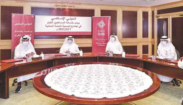 Sheikh Dr Khalid and other QIIB directors at the bank's virtual ordinary general assembly