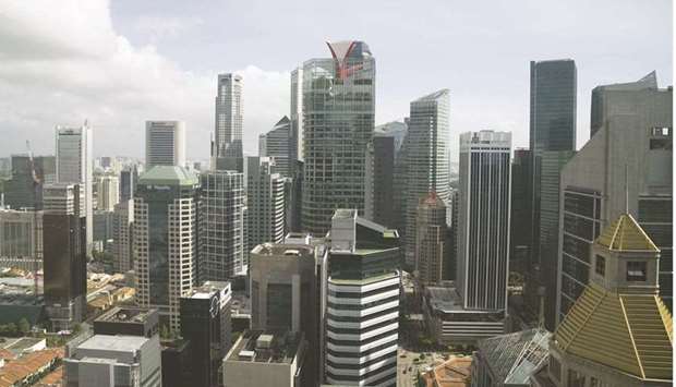 Commercial and residential buildings in the central business district in Singapore. The underperformance of Singapore-dollar bonds is making way for buyers to return as the nation now offers the highest real yields among top-rated countries.