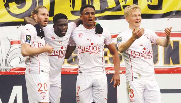 Nimesu2019 Renaud Ripart (left) celebrates his goal with teammates during the Ligue 1 match against Lille yesterday. (Reuters)