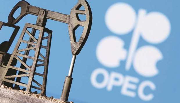A 3D printed oil pump jack is seen in front of displayed Opec logo in this illustration picture. Opec and other key exporters such as Russia, a grouping dubbed Opec+, meet on Thursday and are expected to discuss allowing 1.5mn barrels per day back into the market to address demand likely to be unlocked later in the year as vaccine programmes gather pace.