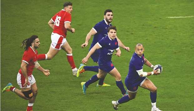 Franceu2019s centre Gael Fickou (right) runs with the ball during the Six Nations match against Wales at the Stade de France in Sain-Denis, Paris, on Saturday. (AFP)