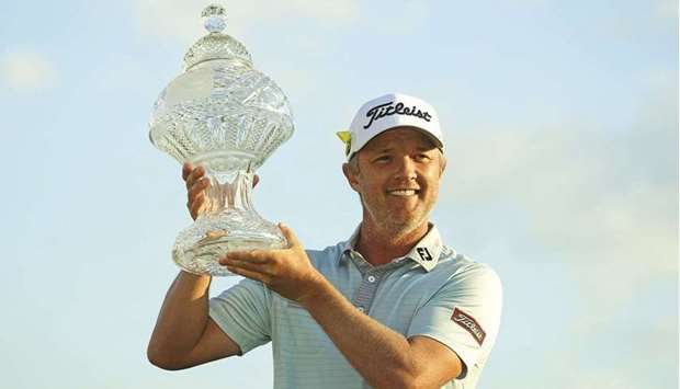 Matt Jones celebrates with the trophy after winning The Honda Classic at the Palm Beach Gardens in Florida. (USA TODAY Sports)