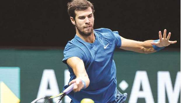 Russiau2019s Karen Khachanov returns the ball to Switzerlandu2019s Stan Wawrinka during the Rotterdam ATP tournament yesterday. (AFP)