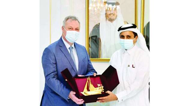 Qatar Chamber chairman Sheikh Khalifa bin Jassim al-Thani handing over a token of recognition to Tunisiau2019s Minister of Economy, Finance, and Investment Support, Ali al-Kaali, on the sidelines of the Qatari-Tunisian Business Forum held at Qatar Chamber Tuesday