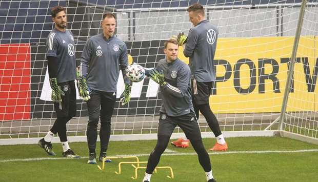 Germanyu2019s captain Manuel Neuer (centre) trains with his teammates yesterday, on the eve of their World Cup qualifiers in Duisburg, Germany. (Reuters)