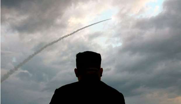 (file photo) North Korean leader Kim Jong Un watching the launch of a ballistic missile at an unknow