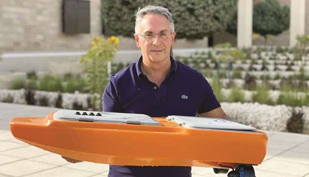 Gianni Di Caro with one of the relatively small aerial and marine robots used as part of the initiat