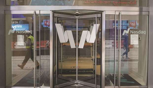 The Nasdaq Inc logo is displayed on the doors at the Nasdaq MarketSite in the Times Square New York. The tech-heavy Nasdaq 100 gained 0.9% for the week, a reversal of the market leadership that prevailed throughout 2021.