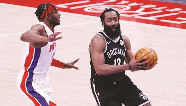 Brooklyn Nets guard James Harden (right) dribbles past Detroit Pistons forward Jerami Grant in the second half at Little Caesars Arena in Detroit. (USA TODAY Sports)