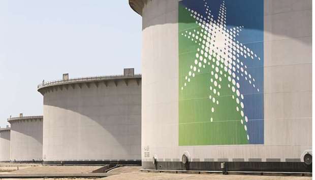 Oil tanks are seen at Saudi Aramcou2019s Ras Tanura oil refinery and oil terminal (file). Aramcou2019s debt swelled to $162bn at the end of 2020 after the company took on $90bn of loans and bonds.
