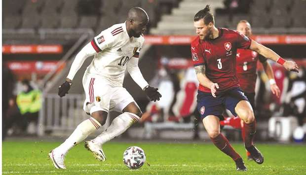 Czech Republicu2019s defender Ondrej Celustka (R) and Belgiumu2019s forward Romelu Lukaku vie for the ball during their FIFA World Cup Qatar 2022 qualification football match in Prague on Saturday.