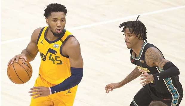 Utah Jazz guard Donovan Mitchell dribbles the ball as Memphis Grizzlies guard Ja Morant defends during the second half at Vivint Smart Home Arena in Salt Lake City, Utah. (USA TODAY Sports)