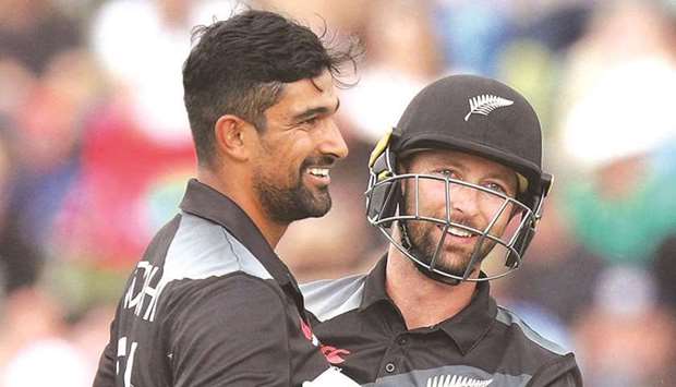 New Zealandu2019s Ish Sodhi (left) is congratulated by wicketkeeper Devon Conway after taking the wicket of Bangladeshu2019s Soumya Sarkar (not pictured) during the first Twenty20 match at Seddon Park in Hamilton, New Zealand, yesterday. (AFP)