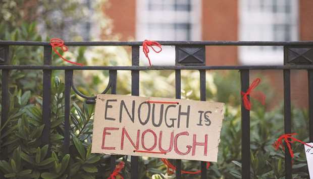 A placard attached to the fence outside the James Allenu2019s Girlsu2019 School in south London yesterday.  (Reuters)