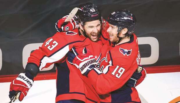 Washington Capitals right wing Tom Wilson (left) celebrates with teammate Nicklas Backstrom after scoring his second goal of the game against the New York Rangers during the second period at Capital One Arena. (USA TODAY Sports)