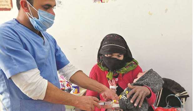 A malnourished child receives treatment at Al-Sabeen Maternity and Child Hospital in the Houthi-rebel-held Yemeni capital Sanaa, yesterday.