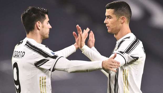 Juventusu2019 Cristiano Ronaldo (R) celebrates scoring their third goal with Alvaro Morata on Tuesday night.