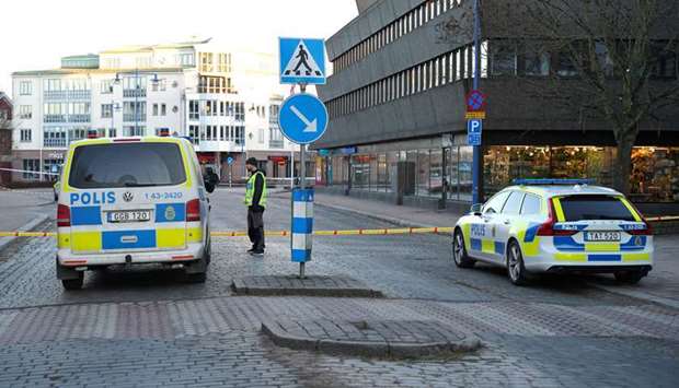 Police gather at the knife attack site in Vetlanda, Sweden
