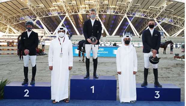Asian and Qatar Equestrian Federation president Hamad bin Abdulrahman al-Attiyah and Omar al-Mannai, LGCT Event Director and Commercial Manager at Al Shaqab with the podium finishers of the CSI5* 1.45m class on Thursday.